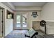 Unfinished basement area equipped with workout equipment and an exterior exit at 1263 Whisperwood Ln, Lawrenceville, GA 30043