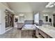 Bathroom featuring a tiled shower, tiled floor, soaking tub, and vanity at 1263 Whisperwood Ln, Lawrenceville, GA 30043
