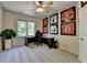 Bedroom with a desk, framed jerseys, and natural light from the window at 1263 Whisperwood Ln, Lawrenceville, GA 30043