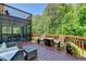 Spacious deck offering comfortable seating and serene views of the lush green trees at 1263 Whisperwood Ln, Lawrenceville, GA 30043