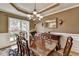 Formal dining room with traditional furnishings, a chandelier, and a large window at 1263 Whisperwood Ln, Lawrenceville, GA 30043