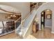 Spacious foyer with hardwood floors, staircase and view into the formal dining room at 1263 Whisperwood Ln, Lawrenceville, GA 30043