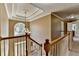 An elegant hallway with crown molding, chandelier and a staircase leading to the front entrance at 1263 Whisperwood Ln, Lawrenceville, GA 30043