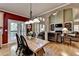 Dining area and kitchen showcasing a view of the bright and spacious living room with hardwood floors at 1263 Whisperwood Ln, Lawrenceville, GA 30043