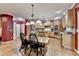 Spacious kitchen features light wood cabinets, stainless steel appliances, and a central island with bar seating at 1263 Whisperwood Ln, Lawrenceville, GA 30043