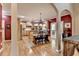 Open kitchen with natural wood cabinetry, stainless appliances, and a breakfast nook, perfect for Gathering gatherings at 1263 Whisperwood Ln, Lawrenceville, GA 30043