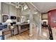 Open-concept living space with soaring ceilings, hardwood floors, and connected to other areas of the home at 1263 Whisperwood Ln, Lawrenceville, GA 30043