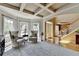 Bright living room with coffered ceiling and view into the front entrance at 1263 Whisperwood Ln, Lawrenceville, GA 30043