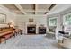 Inviting living room with fireplace, coffered ceiling, and ample seating at 1263 Whisperwood Ln, Lawrenceville, GA 30043