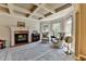 Cozy living room featuring a fireplace, coffered ceiling, and lots of natural light at 1263 Whisperwood Ln, Lawrenceville, GA 30043