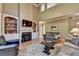 Inviting living room with a fireplace, custom built-ins, hardwood floors, and ample seating for relaxation at 1263 Whisperwood Ln, Lawrenceville, GA 30043