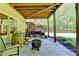 Outdoor patio area with a grill, fire pit, and seating, ideal for relaxing and outdoor gatherings at 1263 Whisperwood Ln, Lawrenceville, GA 30043