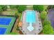Aerial view of a community pool featuring lounge chairs, tables, and a pergola covered seating area at 1263 Whisperwood Ln, Lawrenceville, GA 30043