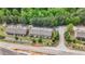 Townhome community showcases lush greenery and well-maintained exteriors in an aerial view at 137 White Mountain Pass, Mcdonough, GA 30252
