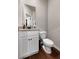 This half bathroom features a white cabinet with granite top, a modern sink, and sleek fixtures at 137 White Mountain Pass, Mcdonough, GA 30252