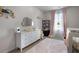 Bedroom featuring a white dresser, pink accents, and stylish decor for a comforting space at 137 White Mountain Pass, Mcdonough, GA 30252