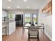 Dining area with modern furnishings adjacent to a kitchen at 137 White Mountain Pass, Mcdonough, GA 30252