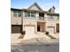 Charming townhome featuring gray and brick exterior, garage, balcony, and landscaped front at 137 White Mountain Pass, Mcdonough, GA 30252