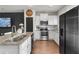 Modern kitchen featuring stainless appliances, granite counters and hardwood floors at 137 White Mountain Pass, Mcdonough, GA 30252