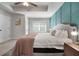 Spacious main bedroom with a modern accent wall, plush bed, and soft lighting at 137 White Mountain Pass, Mcdonough, GA 30252