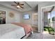 Spacious main bedroom features a tray ceiling, TV, balcony, and an en suite bath for added privacy at 137 White Mountain Pass, Mcdonough, GA 30252