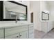 Bathroom showcasing double sinks, a tile floor, and a view of the walk-in shower at 2160 Waters Ferry Dr, Lawrenceville, GA 30043