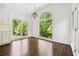 Charming breakfast nook with large windows that provide plenty of natural light and views of the green outdoors at 2160 Waters Ferry Dr, Lawrenceville, GA 30043