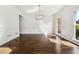 Spacious dining room with hardwood floors, wainscoting, crown molding, and natural light at 2160 Waters Ferry Dr, Lawrenceville, GA 30043