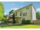Back exterior featuring a multi-level deck, patio, and well-maintained lawn at 2160 Waters Ferry Dr, Lawrenceville, GA 30043