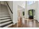 Elegant foyer with hardwood floors, staircase, and large windows allowing ample natural light at 2160 Waters Ferry Dr, Lawrenceville, GA 30043