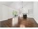 Bright and airy living room with a fireplace, built-in shelving, and large windows overlooking outdoor living space at 2160 Waters Ferry Dr, Lawrenceville, GA 30043