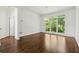 Bright living room featuring beautiful hardwood floors and large windows with outdoor views at 2160 Waters Ferry Dr, Lawrenceville, GA 30043