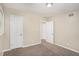 Well-lit bedroom with neutral walls, plush carpeting, and freshly painted doors at 310 Oak Se Dr, Atlanta, GA 30354