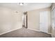 Neutral bedroom with plush carpeting and entry to other rooms at 310 Oak Se Dr, Atlanta, GA 30354