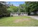 Charming home with a well-maintained front yard and classic ranch architecture at 310 Oak Se Dr, Atlanta, GA 30354