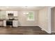 Eat-in kitchen featuring stainless steel appliances and hardwood flooring at 310 Oak Se Dr, Atlanta, GA 30354