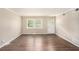 Living room with hardwood flooring, natural light, and a front door at 310 Oak Se Dr, Atlanta, GA 30354