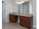 Bathroom vanity with dual sinks, granite countertops, and wood cabinets at 415 Village Way, Woodstock, GA 30188