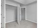 Bedroom closet with shelving and open doors at 415 Village Way, Woodstock, GA 30188