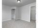 Empty bedroom with neutral carpet flooring and a closet at 415 Village Way, Woodstock, GA 30188