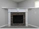 Stone fireplace with white mantle in a room freshly painted in neutral tones at 415 Village Way, Woodstock, GA 30188