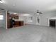 Spacious living room featuring a fireplace, neutral carpet, and adjoining kitchen area at 415 Village Way, Woodstock, GA 30188