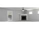 Bright and airy living room with a fireplace and large windows, freshly painted in neutral tones at 415 Village Way, Woodstock, GA 30188