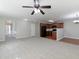 Open floor plan showcasing the kitchen, dining and living area with neutral colors and natural light at 415 Village Way, Woodstock, GA 30188