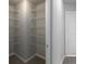 Walk-in closet with wire shelving and neutral carpet at 415 Village Way, Woodstock, GA 30188