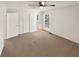 Bedroom with ceiling fan, exterior door, and neutral carpet plus a double closet at 4357 Treeline Way, Douglasville, GA 30135