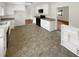 A well-lit kitchen with ample cabinet space, granite countertops, and black appliances at 4357 Treeline Way, Douglasville, GA 30135