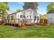 Backyard featuring lush lawn, garden box, wood fence, and deck with seating area at 1481 Almont Sw Dr, Atlanta, GA 30310