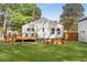 Backyard featuring lush lawn, garden box, wood fence, and deck with seating area at 1481 Almont Sw Dr, Atlanta, GA 30310