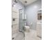 The bathroom features a shower with glass doors, toilet, storage cabinet, and vanity at 1481 Almont Sw Dr, Atlanta, GA 30310